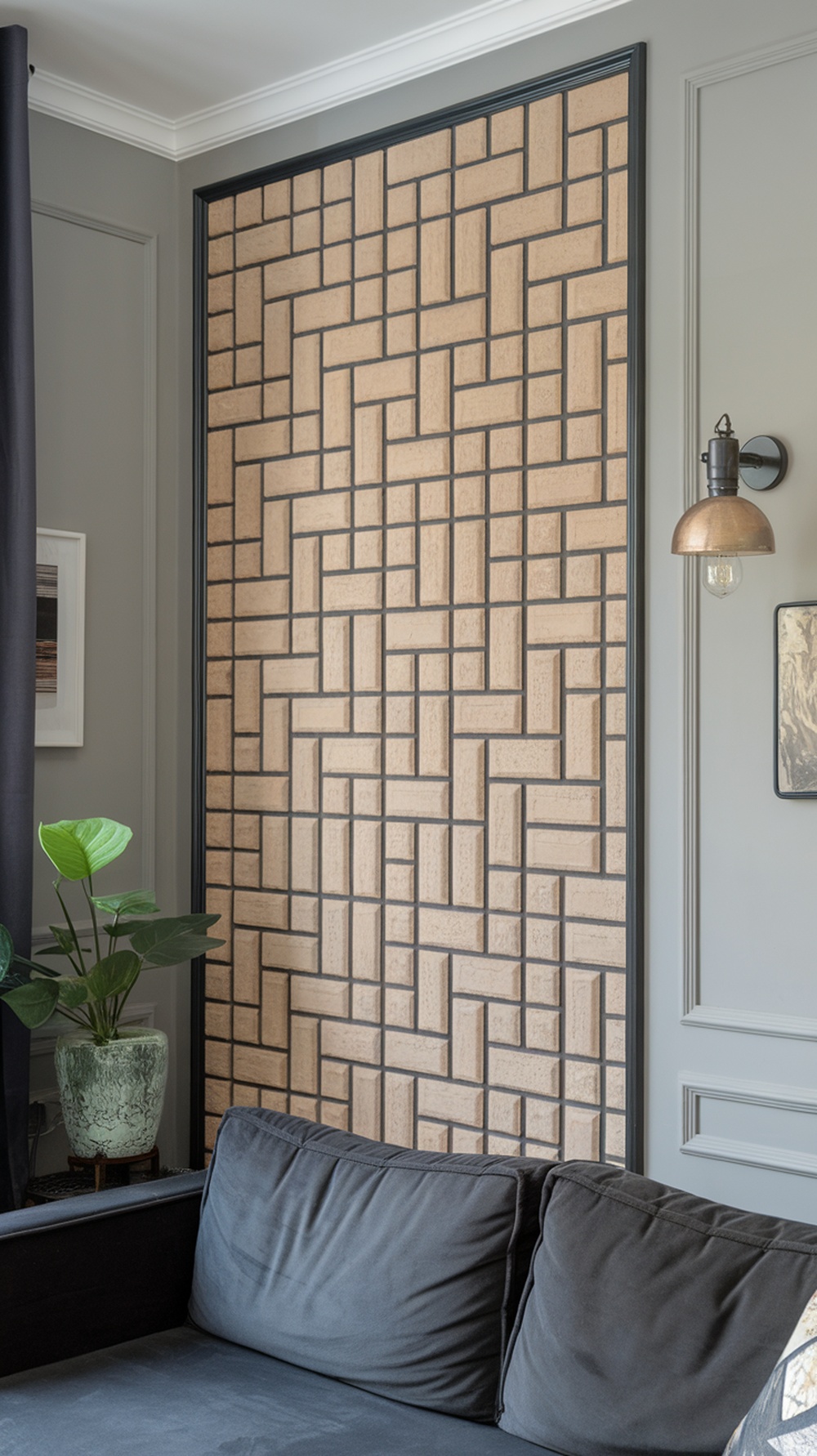 Accent wall in a small apartment living room with geometric pattern and dark sofa